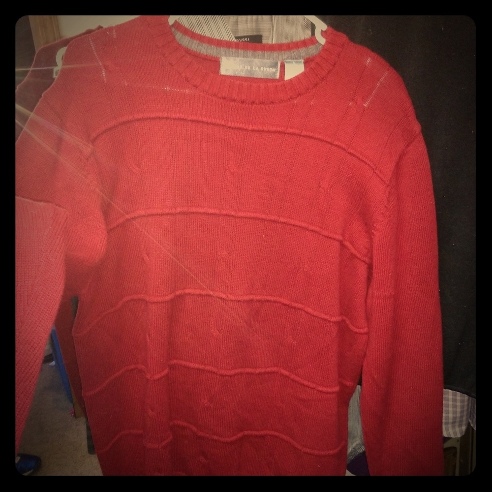 Oscar De Le renta sweater and power tie.